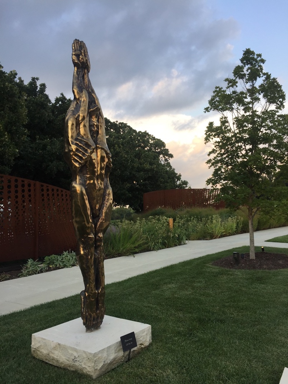 Metallic sculpture of an elongated torso outside of the Wichita Art Museum in Wichita, Kansas