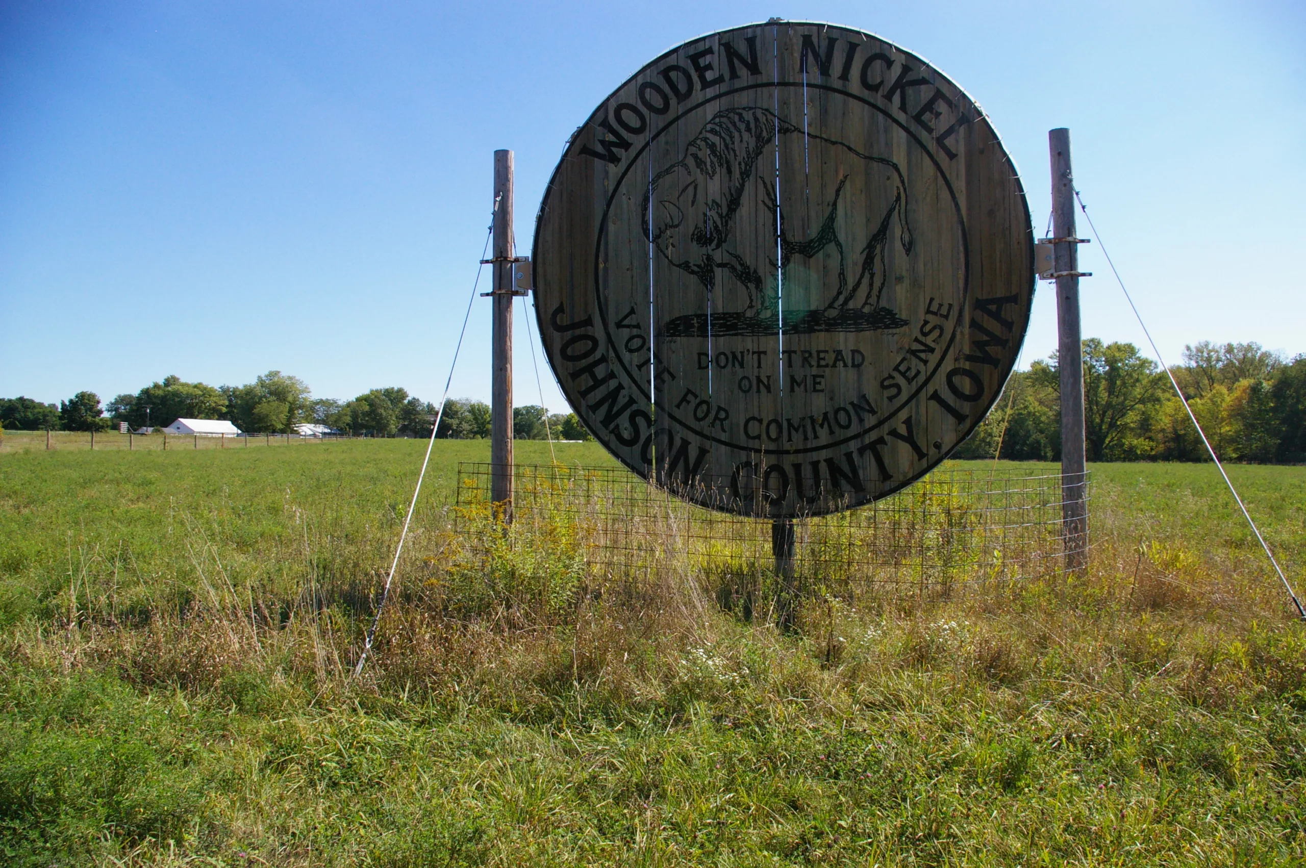 World's Largest Wooden Nickel in a field in Iowa City, Iowa