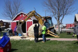Removing previous World's Largest Ball of Popcorn with bulldozer in Sac City, Iowa
