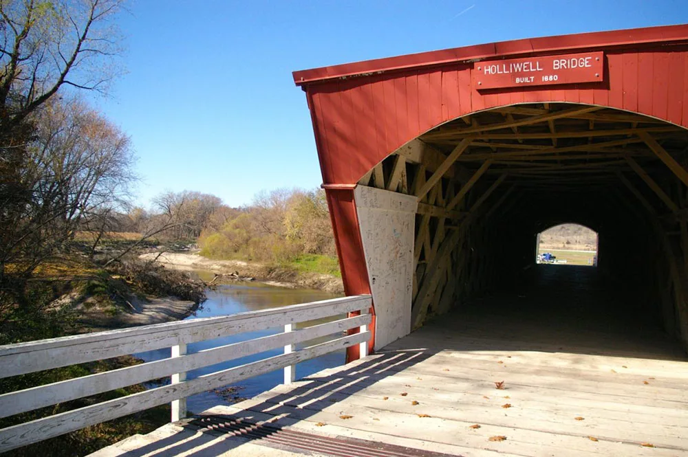 Red painted exterior and entrance of the Holliwell Covered Bridge, , one of the six remaining Bridges of Madison County near Winterset, Iowa