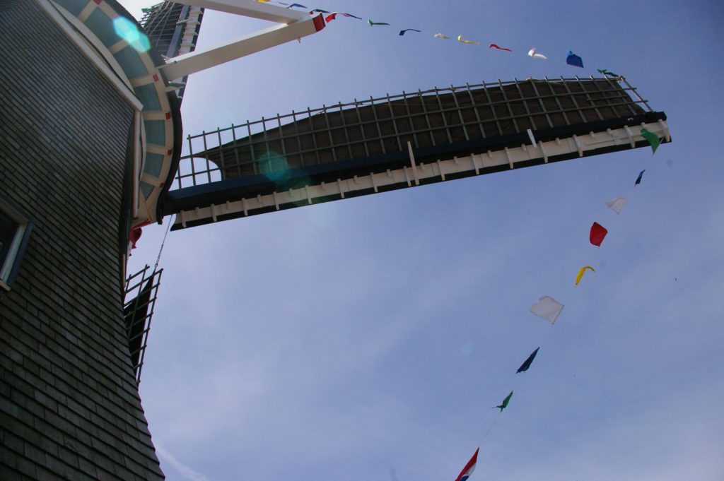 Flags on the blades of the windmill at the Vermeeer Mill in Pella, Iowa