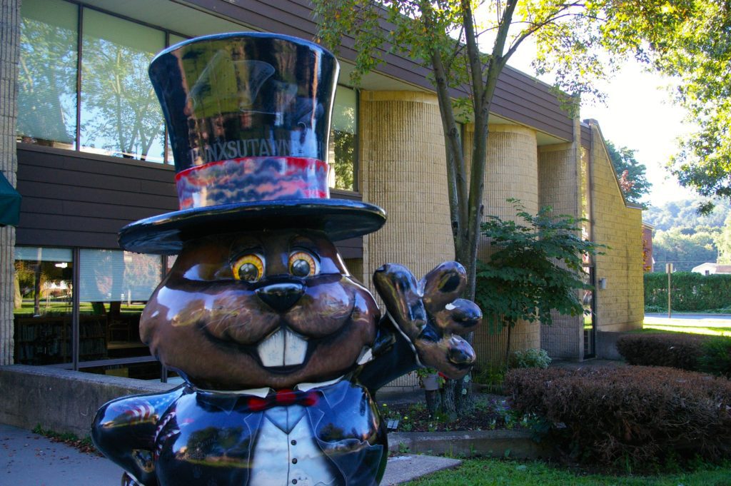 Groundhog statue wearing a tuxedo and top hat in Punxsutawney, Pennsylvania