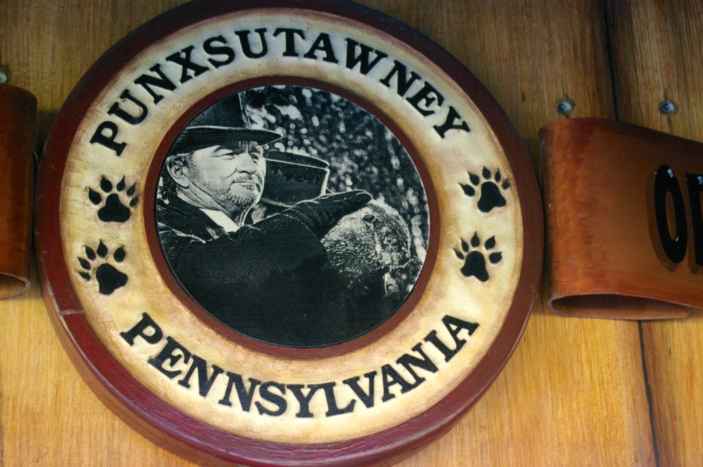 Wooden seal that says Punxsutawney Pennsylvania featuring image of Punxsutawney Phil on Groundhog Day