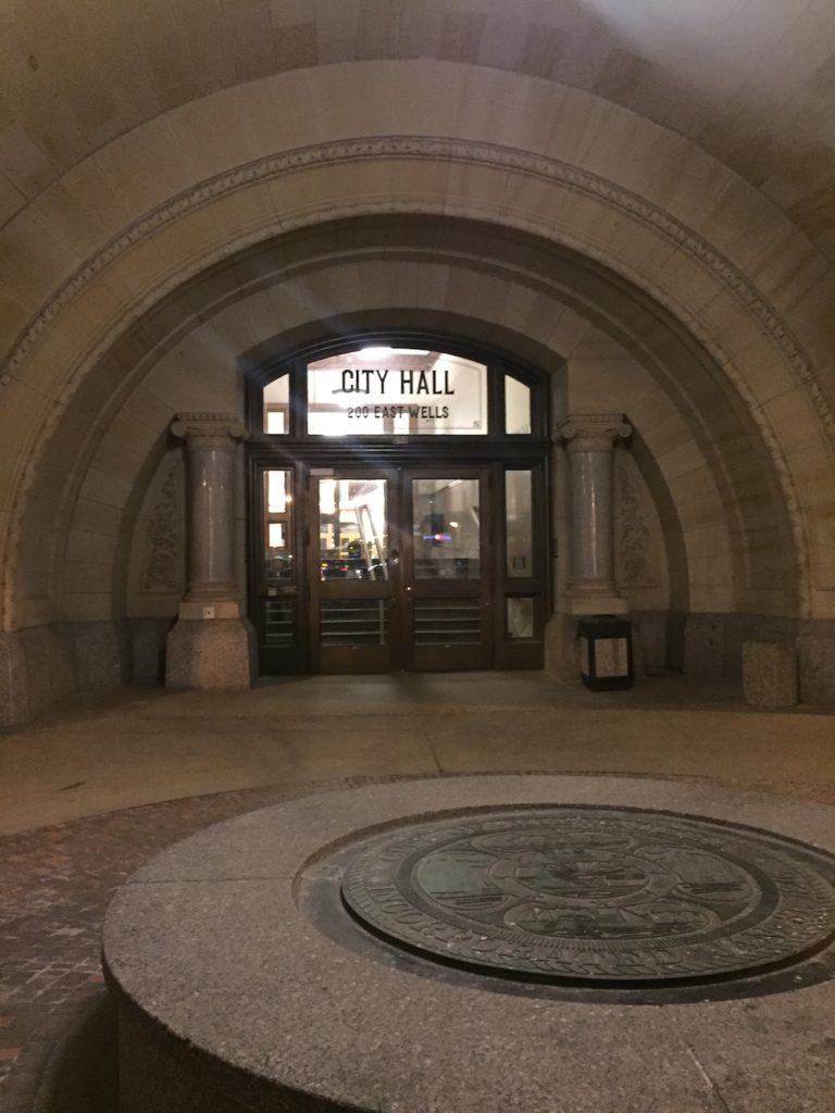 Exterior of arched City Hall entryway in Milwaukee, Wisconsin