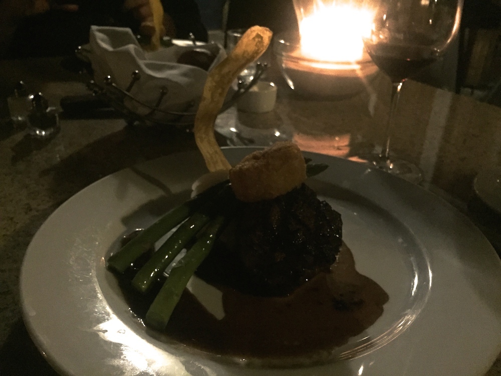 Filet mignon topped with an onion ring at Josef Steakhouse & Oyster Bar in Rockford, Illinois