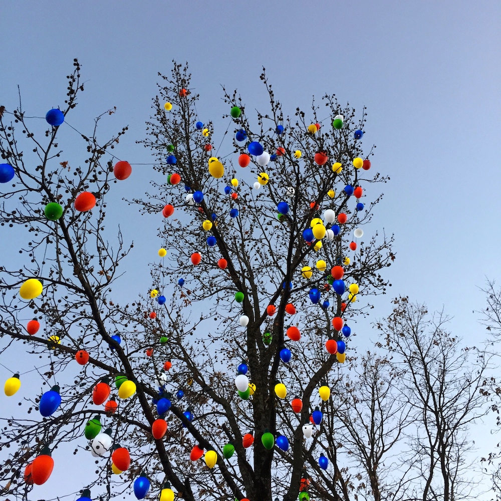 Large colored bulb lights in a tree at Worlds of Fun's WinterFest in Kansas City, Missouri