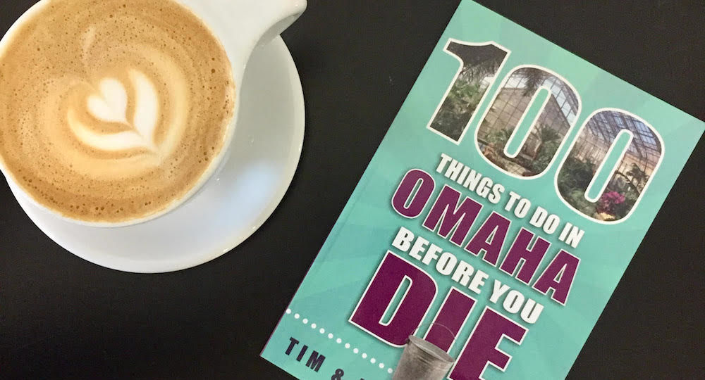100 Things to Do in Omaha Before You Die book with latte on counter