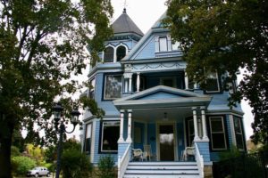 Blue victorian home in the Courthouse Hill Historic District of Janesville, Wisconsin