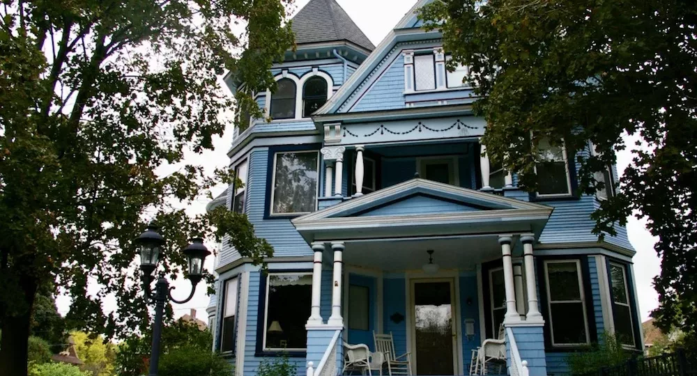 Blue victorian home in the Courthouse Hill Historic District of Janesville, Wisconsin