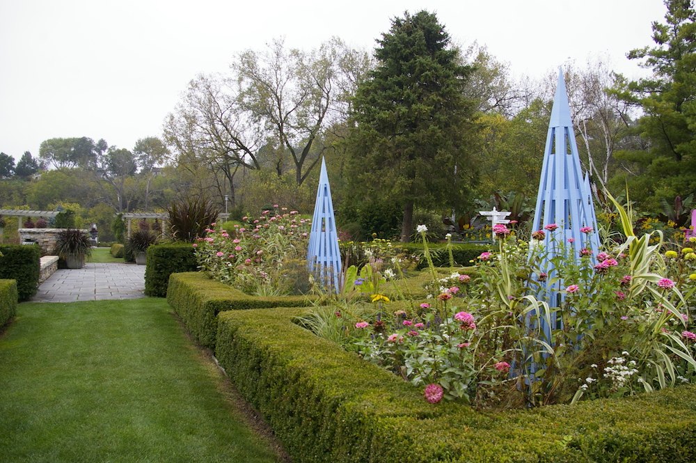 Hedges with flowers and blue trellis at the Rotary Botanical Gardens in Janesville, Wisconsin