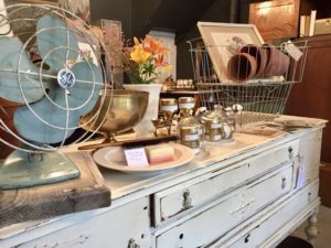 Antique fan and other items on a vintage dresser at JB Knacker in Gilbert, Iowa