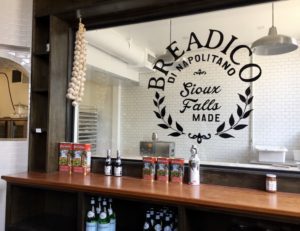 Counter and window to bakery with logo at Breadico in Sioux Falls, South Dakota