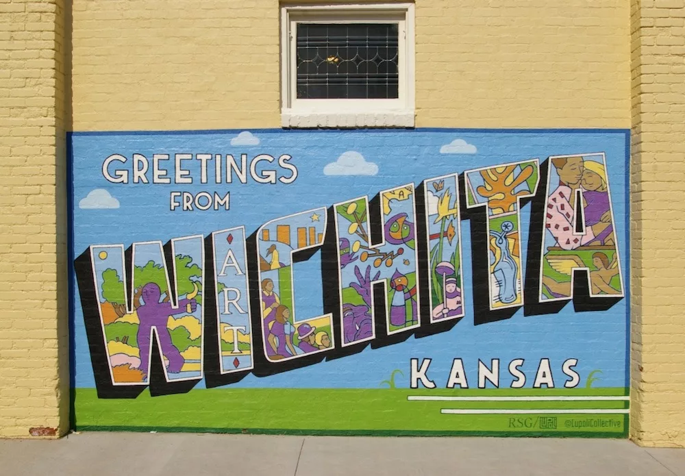 Greetings from Wichita, Kansas mural featuring iconic sites of Wichita in the Douglas Design District in downtown Wichita, Kansas