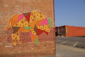 Mural of a bison made up of sunflowers in the Douglas Design District of Wichita, Kansas