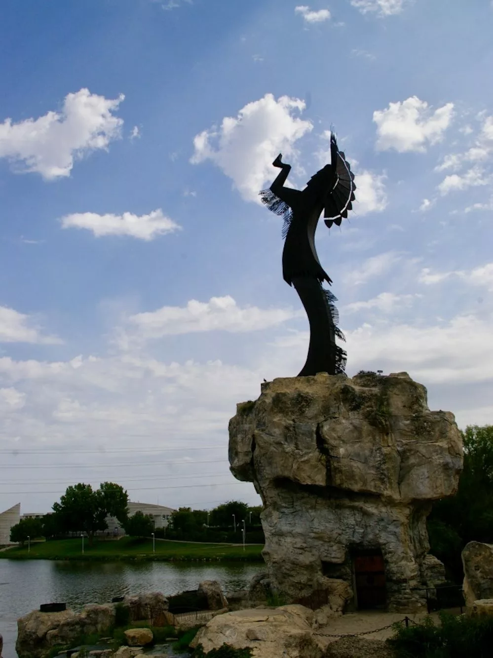 Large metal sculpture of a Native American warrior known as the Keeper of the Plains at the confluence of the Arkansas and Little Arkansas rivers in Wichita, Kansas