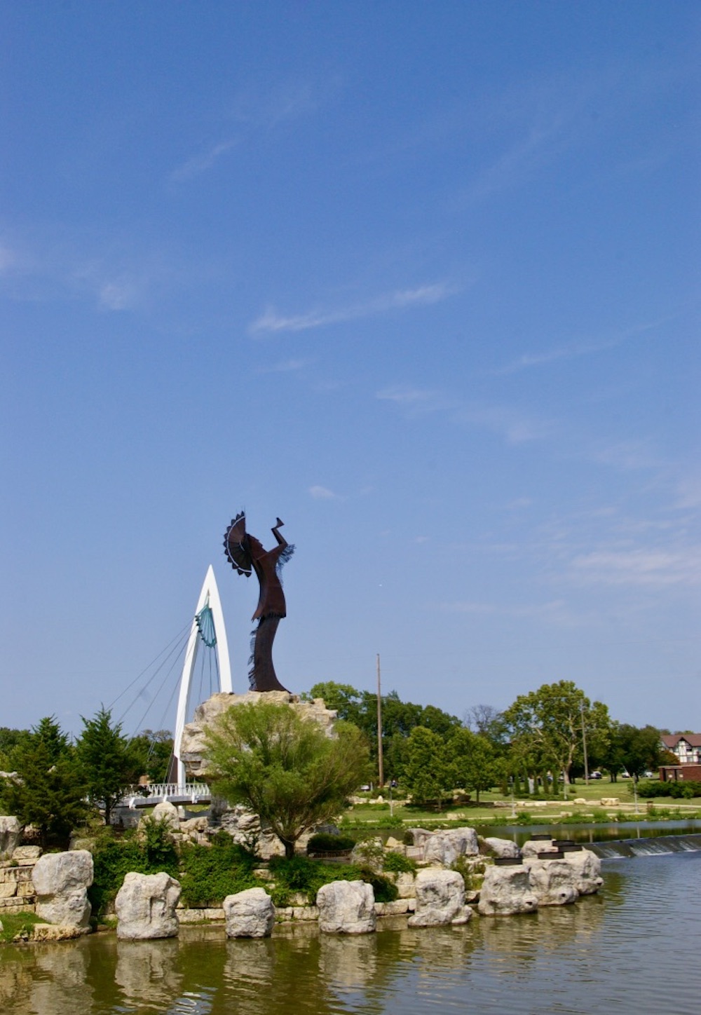 Large metal sculpture of a Native American warrior known as the Keeper of the Plains at the confluence of the Arkansas and Little Arkansas rivers in Wichita, Kansas