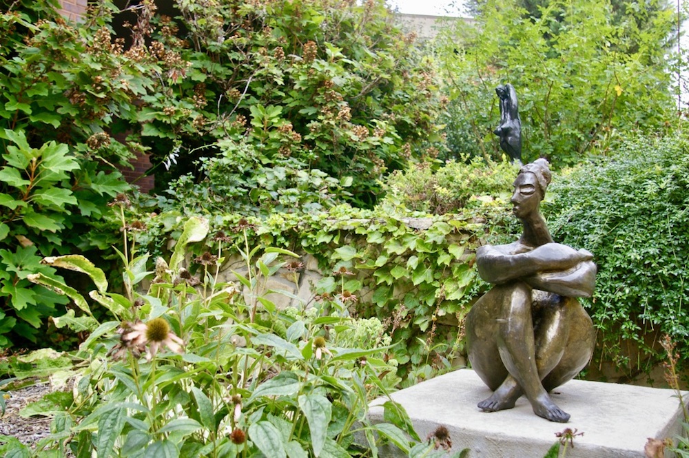 Bronze statues of seated women outside of the Ulrich Museum of Art on the Wichita State Campus in Wichita, Kansas