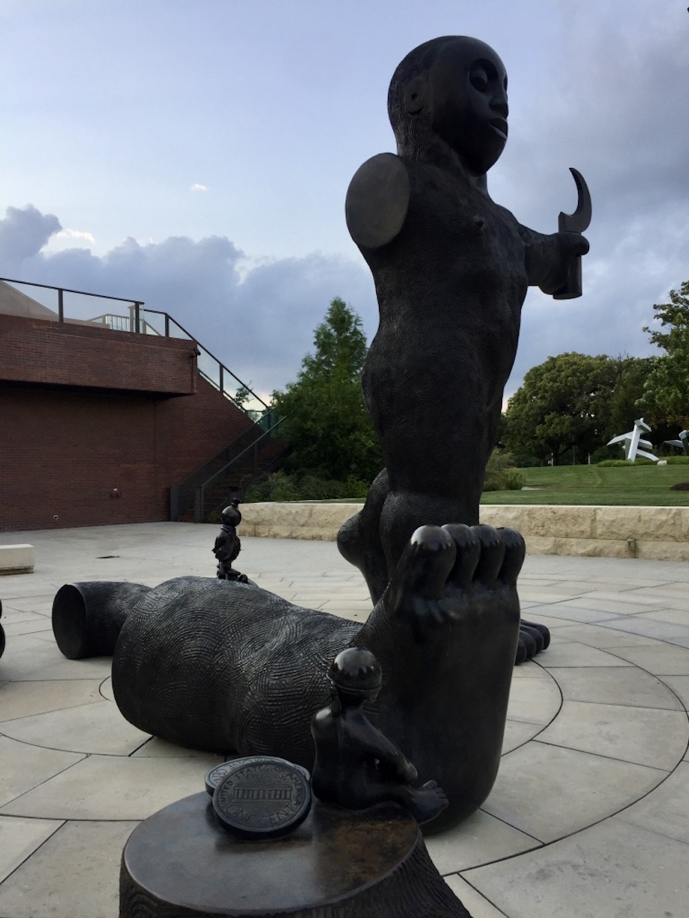 Tall metal sculpture with severed limbs outside of the Wichita Art Museum in Wichita, Kansas