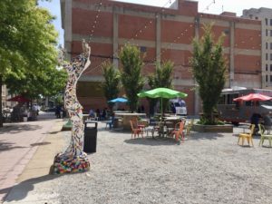 Food trucks and colorful patio seating at the ICT Pop-Up Park in downtown Wichita, Kansas