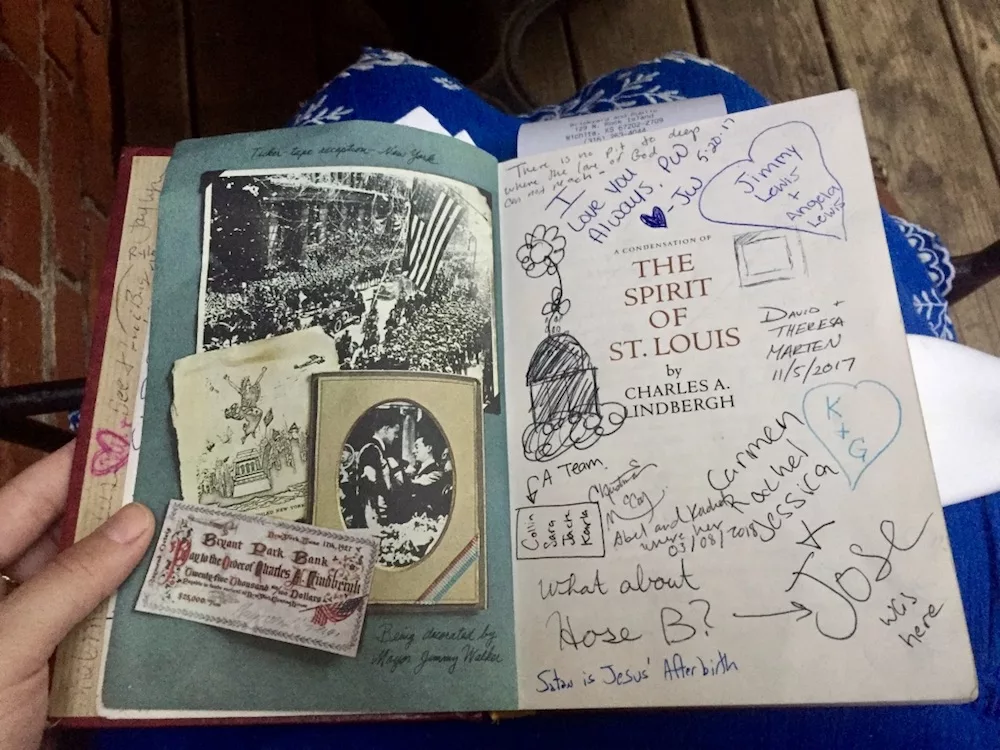 Old book full of messages and signatures with check at Public at the Brickyard in Wichita, Kansas
