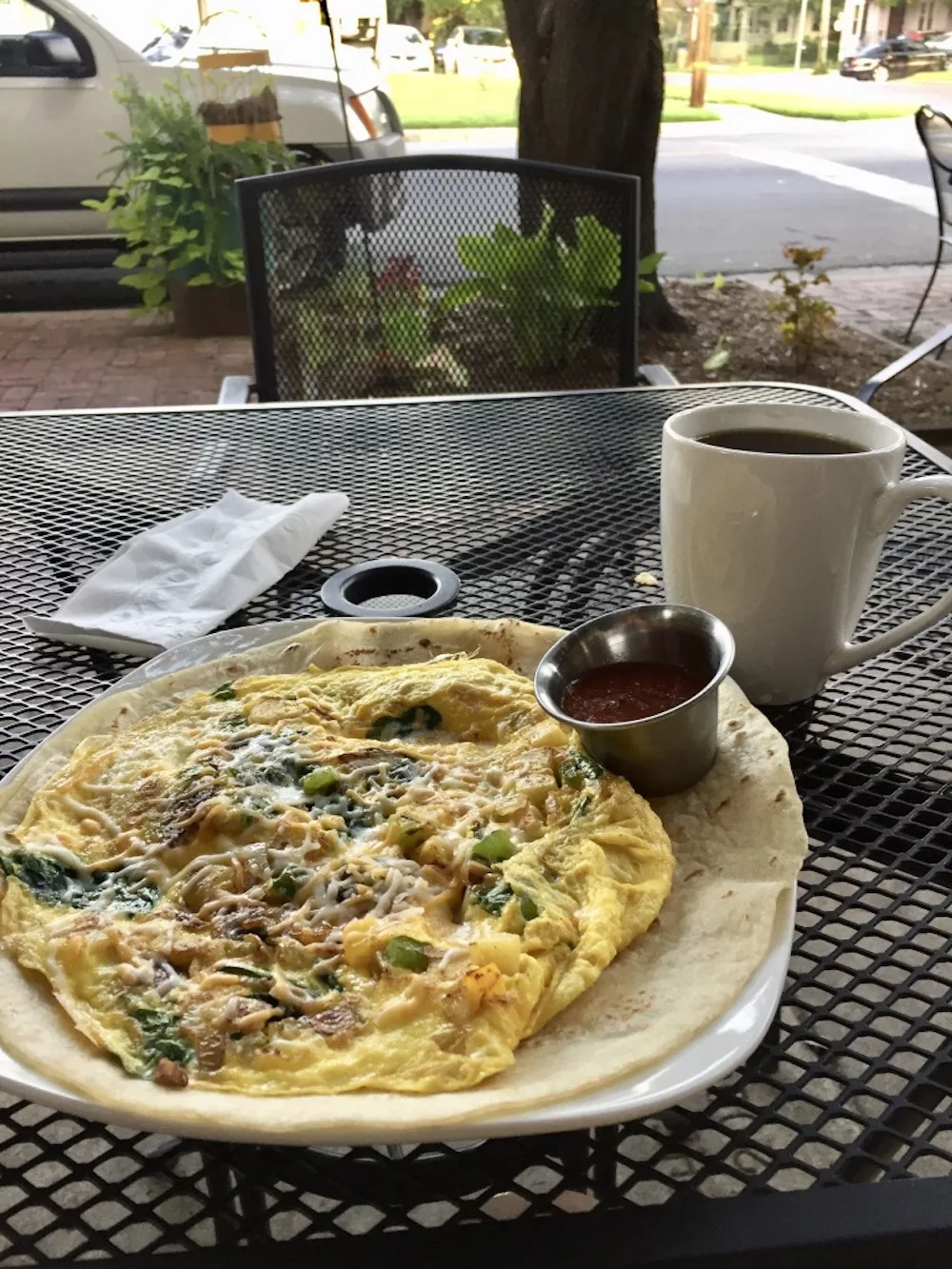 Veggie omelette with coffee on the patio of RCoffeehouse in Wichita, Kansas