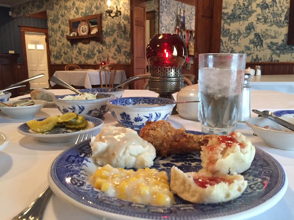 Family-style chicken dinner on traditional China at the Brookville Hotel in Abilene, Kansas