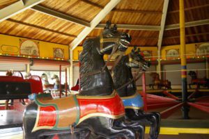 Black carousel horse with red and gold saddle at the Dickinson County Heritage Center in Abilene, Kansas