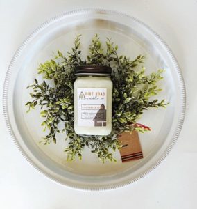 Dirt Road Candle Co candle is a bowl of holiday branches