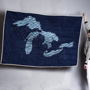 Queen sized quilt with the shape of the Great Lakes on it