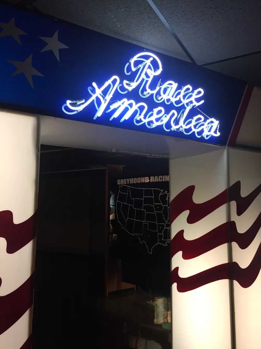Race America blue neon sign at the Greyhound Hall of Fame in Abilene, Kansas
