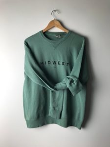 Green crewneck sweatshirt that says "Midwest"