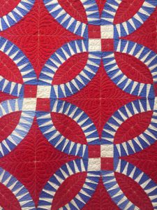 Detail of a red, white and blue embroidered quilt at the Iowa Quilt Museum in Winterset, Iowa