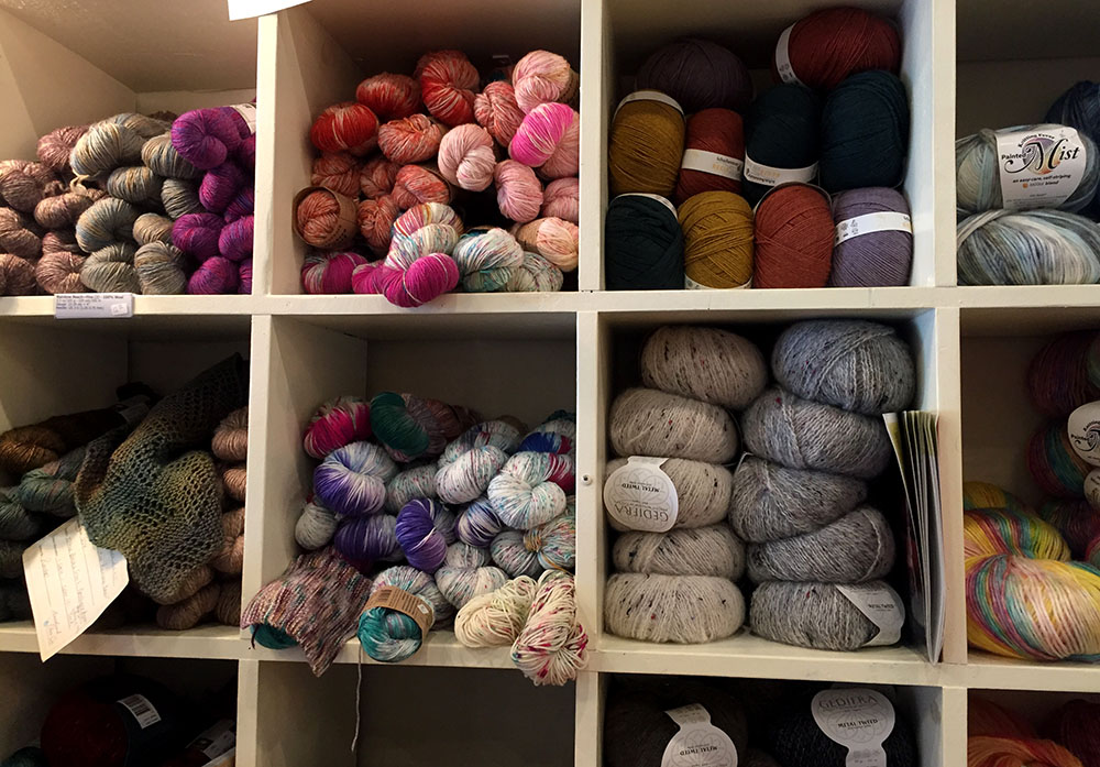 Colorful balls of yarn on shelves at Heartland Fiber Co. in Winterset, Iowa