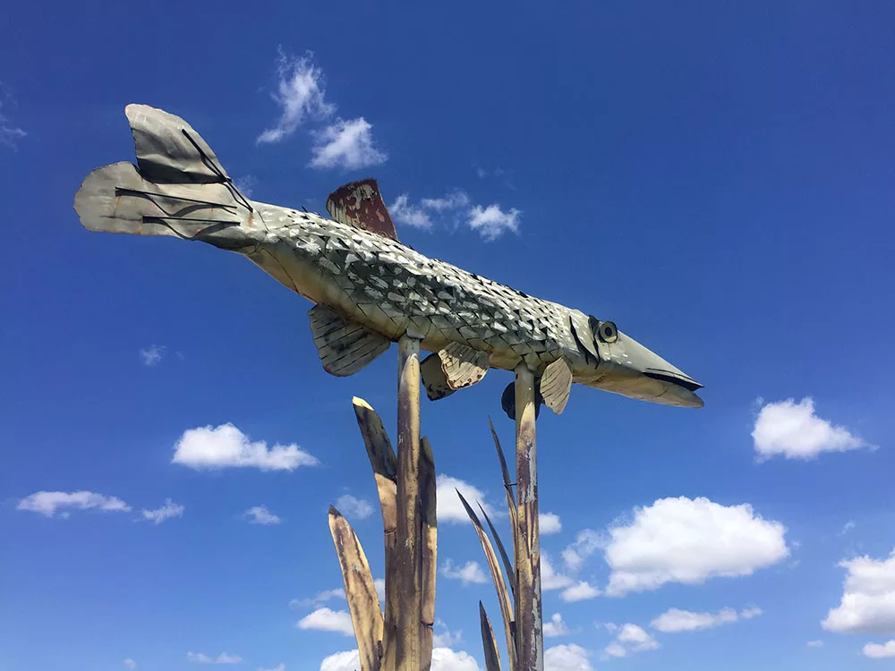 Large metal fish sculpture at Fisherman's Dream installation along the Enchanted Highway near Regent, North Dakota