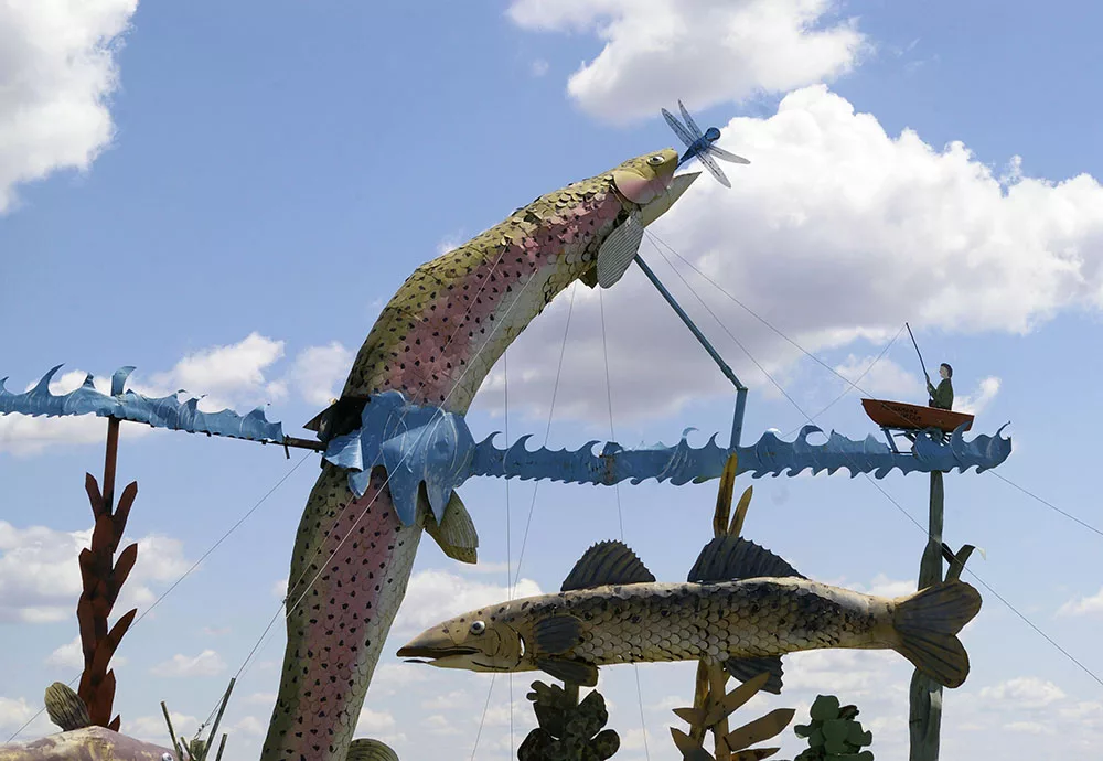Large metal sculptures of fish jumping along the Enchanted Highway near Regent, North Dakota