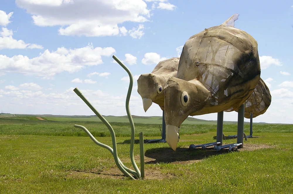 Large metal pheasant sculptures along the Enchanted Highway near Regent, North Dakota