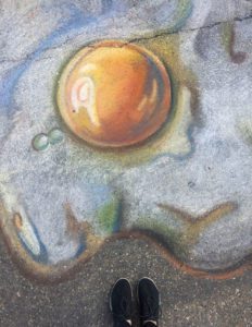 Egg and yolk drawn with chalk during Mount Vernon's 2019 Chalk the Walk