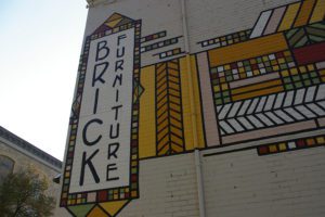 Frank Lloyd Wright inspired mural on the exterior of Brick Furniture in Mason City, Iowa
