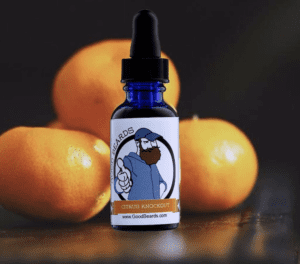Bottle of beard oil from Good Beards with oranges in background