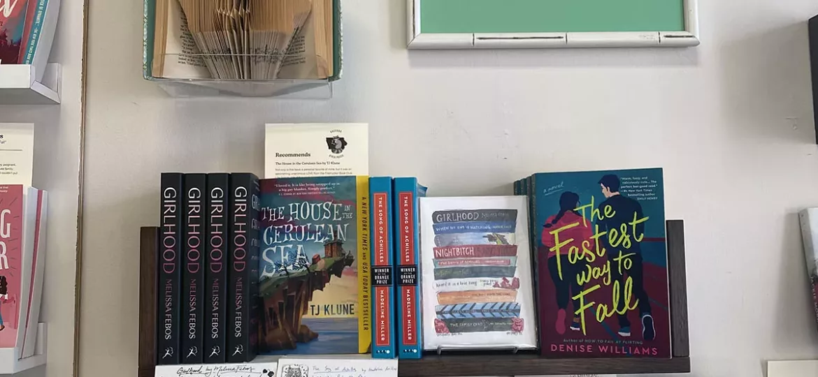 Bookshelf with local recommendations at Storyhouse Bookpub in Des Moines, Iowa