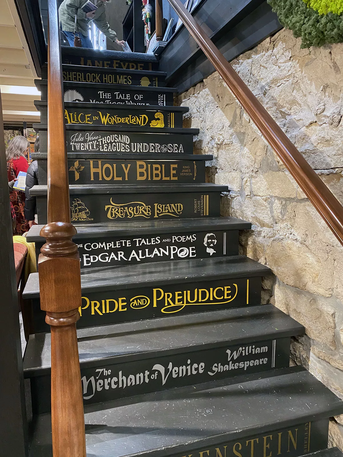 Stairs designed to look like book spines in The Curiosity Shop in Pella, Iowa