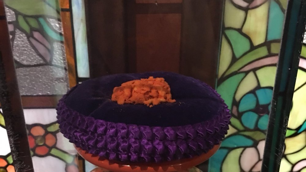 World's Largest Cheeto on purple velvet pillow at Emerald's in Algona, Iowa