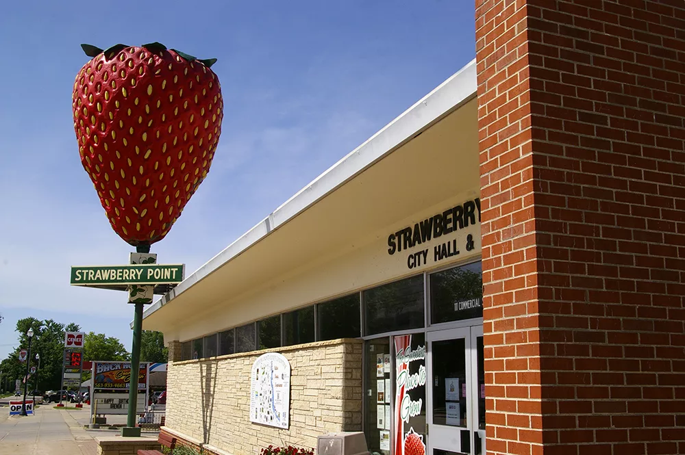 Sculpture of the World's Largest Strawberry outside of city hall in Strawberry Point, Iowa