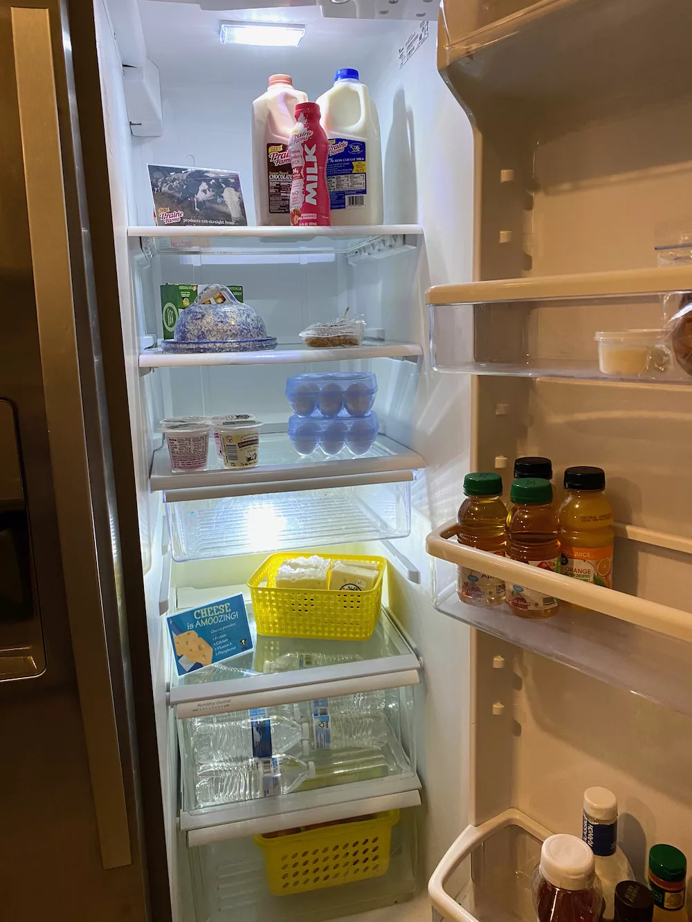 Stocked fridge for DIY continental breakfast at New Day Dairy Guest Barn in Clarksville, Iowa