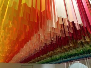 Rainbow streamer installation at the Color Factory in New York City, New York
