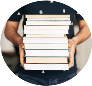 Image of person holding a stack of books