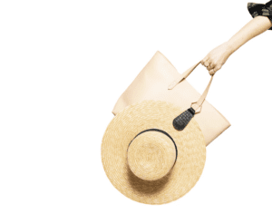 Sun hat clipped on tan tote bag