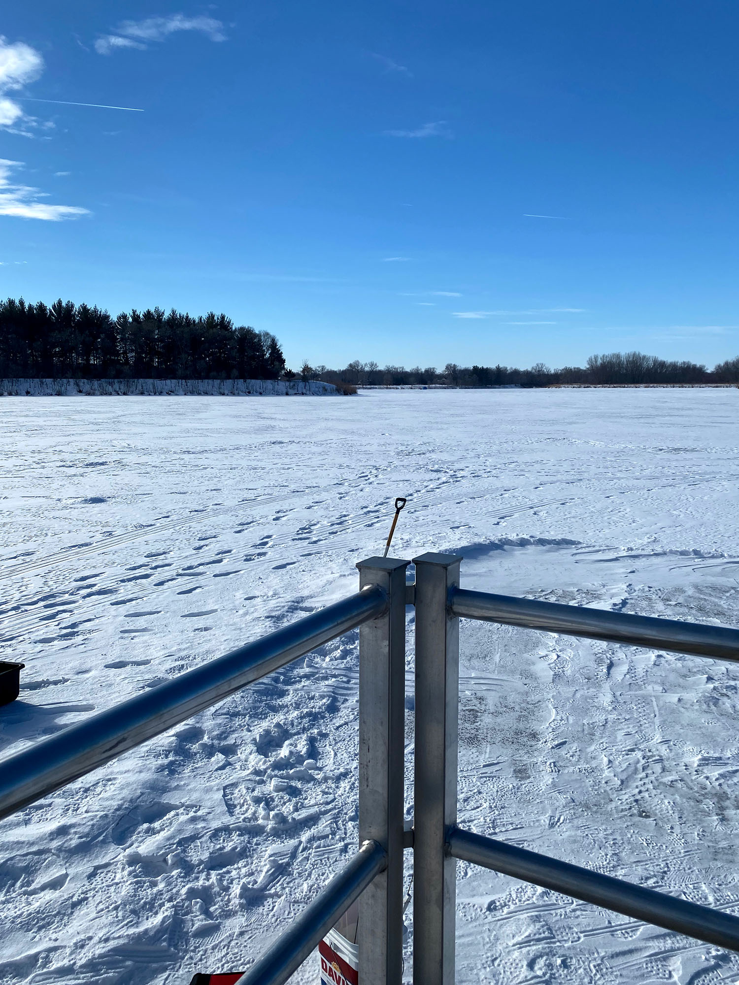 Frozen snow-covered lake at Big Creek Lake Recreation Area during the 2022 Ice Harvest Festival in Cedar Falls, Iowa