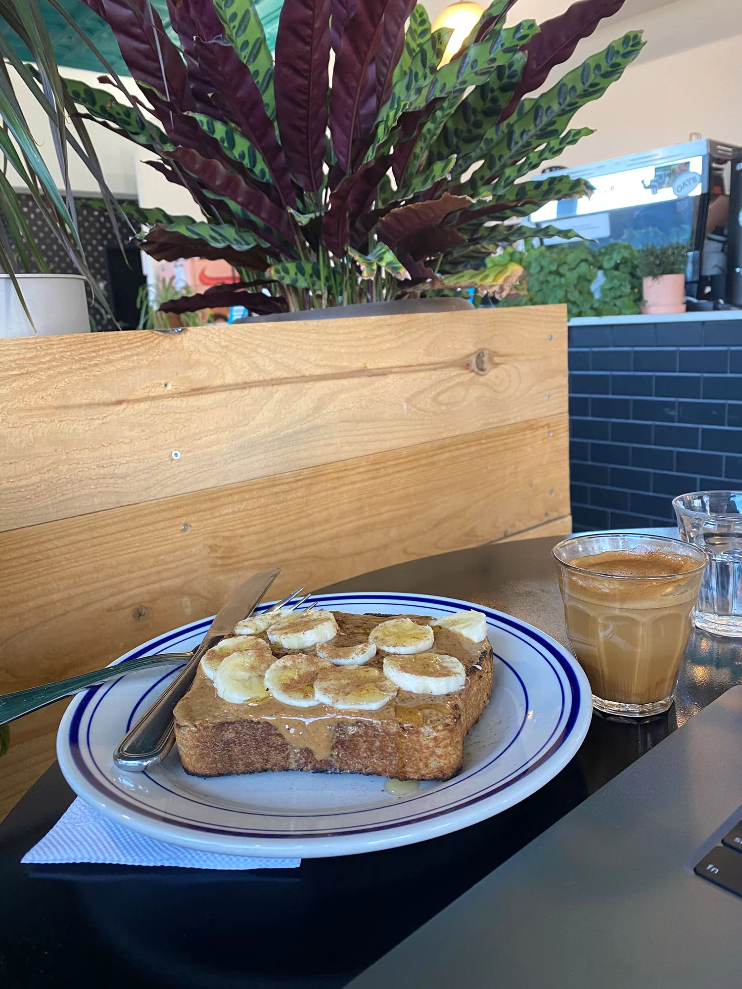 Peanut butter and banana toast and cortado on a table at Leslie Coffee Co. in Wichita, Kansas