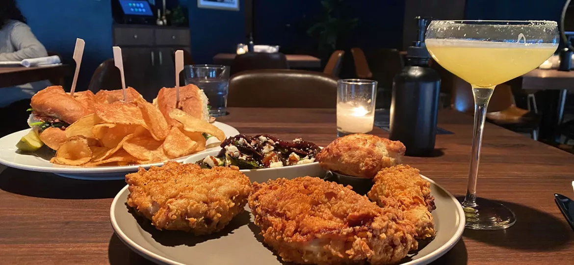 Fried chicken with sandwich and cocktails at The Belmont in Wichita, Kansas